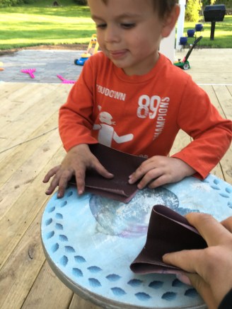 Benny helping me sand the table... Don't mind that he is covered in dirt!! This kid plays hard 😀